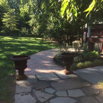 Giron Landscaping & Construction - a stone walkway with two urns - General Contractors Near Me - Montgomery, New York Giron Landscaping & Construction - a stone walkway with two urns - General Contractors Near Me - Montgomery, New York