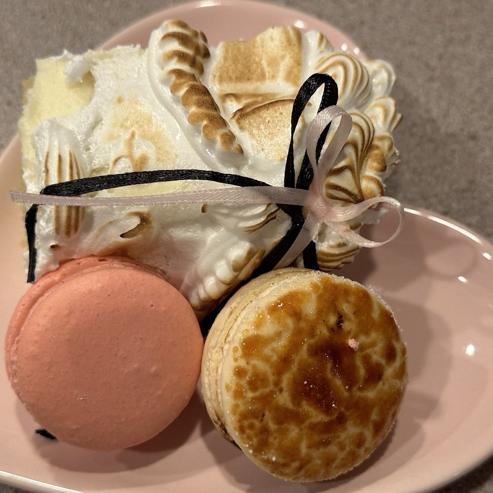 The Cookie Shop - Slice of vintage meringue cake with white chocolate raspberry and creme brûlée macarons - Bakeries Near Me - Brookhaven, New York The Cookie Shop - Slice of vintage meringue cake with white chocolate raspberry and creme brûlée macarons - Bakeries Near Me - Brookhaven, New York
