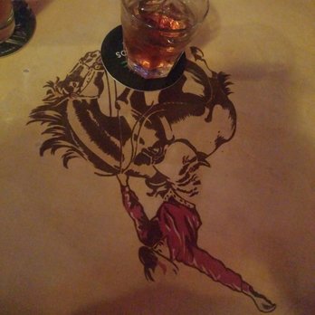 Saddle & Spur - a glass of whiskey on a table - Cocktail Bars Near Me - Douglas, Arizona Saddle & Spur - a glass of whiskey on a table - Cocktail Bars Near Me - Douglas, Arizona