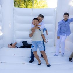 Bride to Be By Tanya - Why walk down the aisle when you can bounce? Our white castle bounce house brings out the inner kid in everyone at this magical wedding.