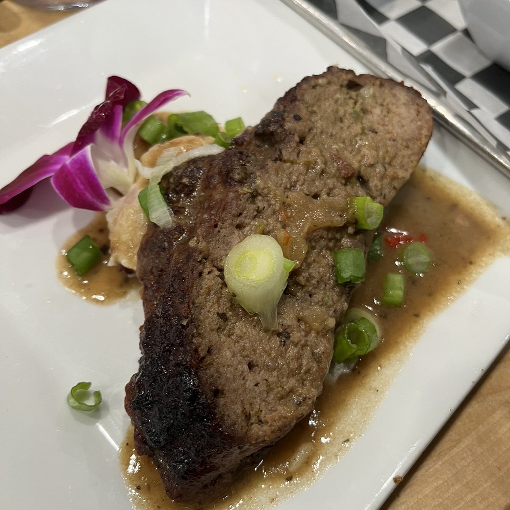Southern Gourmet Kitchen - Yummy meatloaf on top of a bed of mashed potatoes - Southern Near Me - Plano, Texas Southern Gourmet Kitchen - Yummy meatloaf on top of a bed of mashed potatoes - Southern Near Me - Plano, Texas