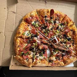 Pizza Man - Large Deluxe Pizza. Delivered in poor condition.