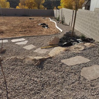 E & A Landscaping & Construction - a backyard with a stone path - Landscaping Near Me - Washington, Utah