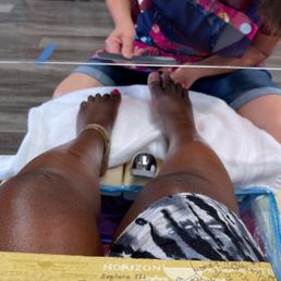 Filing off the gel and prepping for a gel pedicure