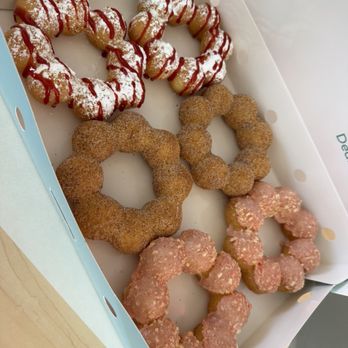 Mochinut - From left to right: raspberry funnel cake, churro, strawberry shortcake - Donuts Near Me - Loma Linda, California Mochinut - From left to right: raspberry funnel cake, churro, strawberry shortcake - Donuts Near Me - Loma Linda, California