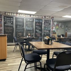 Fresh Garden Market - Very creative use of "C-Store" doors. They painted them with chalk paint and use them for signage. Love it!