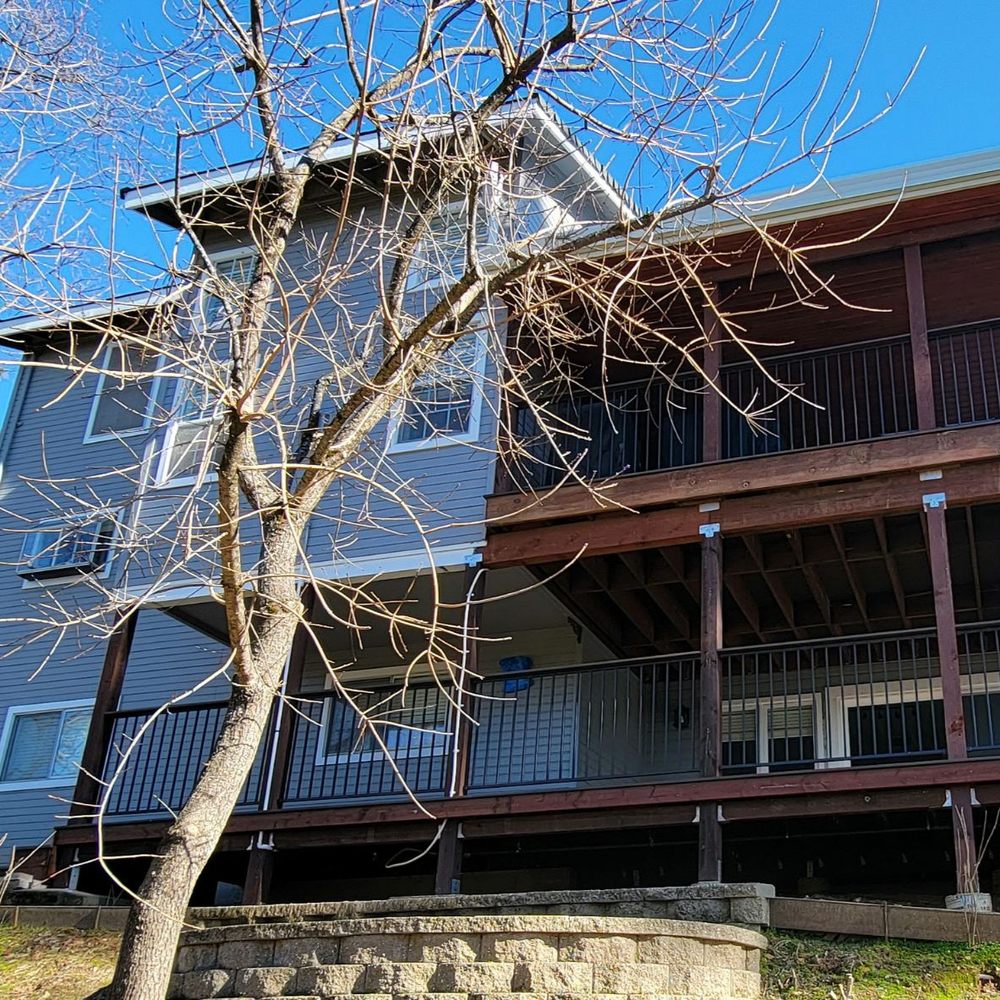 Two story deck with new roof and custom slider on the right. Smaller deck and staircase on the left. Two story deck with new roof and custom slider on the right. Smaller deck and staircase on the left.