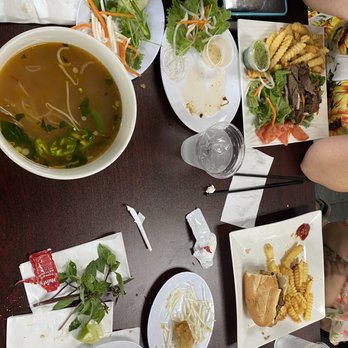 Pho O’clock - Brisket Phò, chicken sandwich, and ribeye over salad with fries. - Vietnamese Near Me - Modesto, California