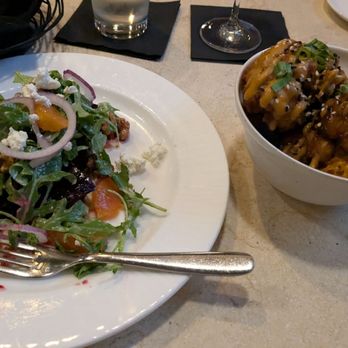The Hobbit Restaurant - Partially eaten roasted beet salad and the "KFC" chicken (cauliflower). Both amazing! - New American Near Me - Ocean City, Maryland