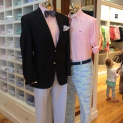Vineyard Vines - Prepster on steroids: seersucker pants, navy blue blazer, pocket silk, pink shirt ,bow tie with boat print.
