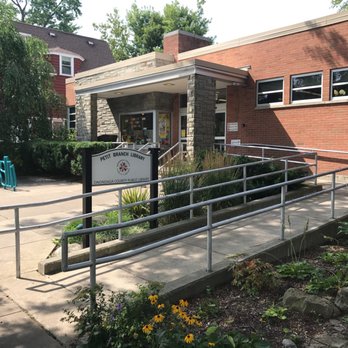 Petit Branch Library - Main entrance to Petit Branch Library with signage and decorative bicycle rack - Libraries Near Me - Syracuse, New York