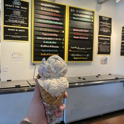 The Latest Scoop - Birthday cake and bourbon butter toffee on a vanilla cone.