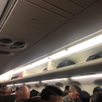 American Airlines - Half empty overhead cabin - Airlines Near Me - Boston, Massachusetts American Airlines - Half empty overhead cabin - Airlines Near Me - Boston, Massachusetts