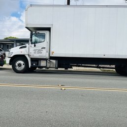 Moving truck on delivery to the new house. Moving truck on delivery to the new house.