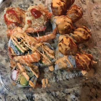 Tomo Sushi & Sashimi - Scorpion Roll (left) 5 pieces, and Big Mama (right) 8 pieces (missing one piece because I couldn't wait to eat). Delicious! - Sushi Bars Near Me - Upper Darby, Pennsylvania