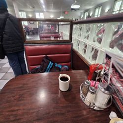 Wally's Restaurant - Booths, tables, and a counter.