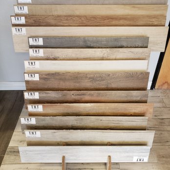 TNT Flooring - a stack of hardwood samples - Flooring Near Me - Phoenix, Arizona