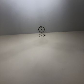 All Ed Electric - The two holes they cut to connect power for mirror and create outlet - Electricians Near Me