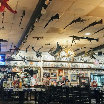 Chef Klaus' Bier Stube - main dining room toward the bar along with the high tables more pub setting.. loads of guns and planes and more on ceiling - German Near Me - Frankfort, Illinois Chef Klaus' Bier Stube - main dining room toward the bar along with the high tables more pub setting.. loads of guns and planes and more on ceiling - German Near Me - Frankfort, Illinois