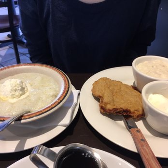 Cajun Kitchen Cafe - Grits, country fried steak with gravy and poached eggs on the side. - Cajun/Creole Near Me - Goleta, California Cajun Kitchen Cafe - Grits, country fried steak with gravy and poached eggs on the side. - Cajun/Creole Near Me - Goleta, California