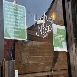 High Note - Front door. It's right next to a pizza place with red/white umbrellas, so don't miss it.