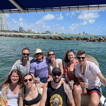 Paul's Miami Boat Tours - group shot with Miami in the background! - Boat Tours Near Me Paul's Miami Boat Tours - group shot with Miami in the background! - Boat Tours Near Me