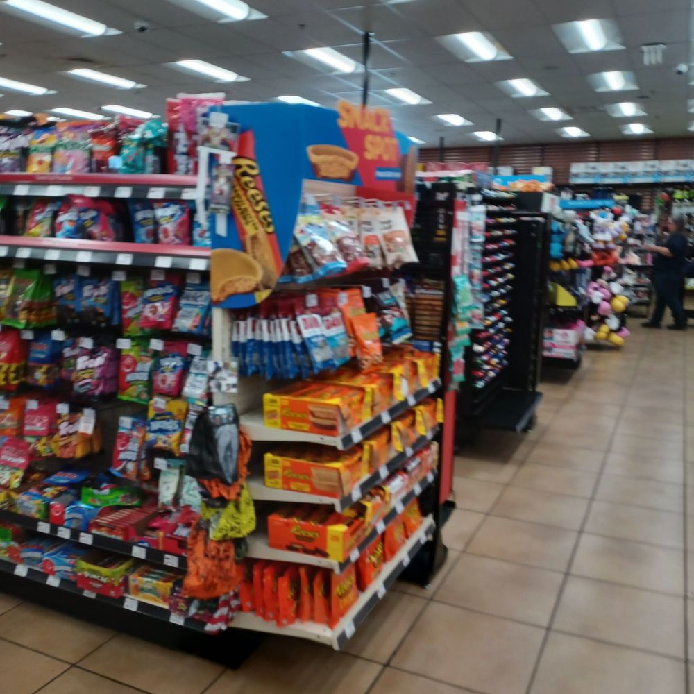 a grocery store aisle filled with snacks a grocery store aisle filled with snacks