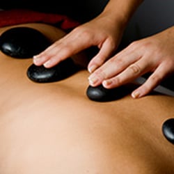One Stop Therapeutic Massage - Hot Stone Therapy relaxes tight muscles and soothes your pain.