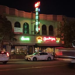 Outside view of sign and restaurant. Outside view of sign and restaurant.