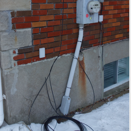 Here's what it looked like outside when the great Bell technician installed our new fibre-optic cable. He left it like this and drove off!