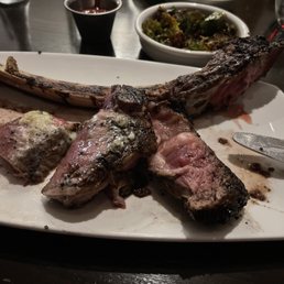 Tomahawk steak with "bacon" Brussel sprouts, and truffle fries.
