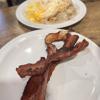 Roni's - Half order of biscuits and sausage gravy with a side of crispy-ish bacon - Breakfast & Brunch Near Me - Sanford, Florida