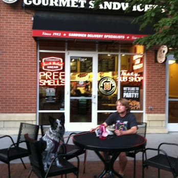 Jimmy John's - a man sitting at a table with his dog - Delis Near Me - Golden, Colorado Jimmy John's - a man sitting at a table with his dog - Delis Near Me - Golden, Colorado