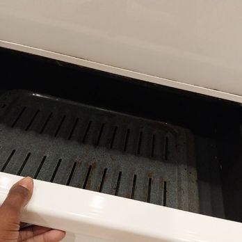 Dynasty Cleaning - Bottom of stove (cleaned) - Home Cleaning Near Me Dynasty Cleaning - Bottom of stove (cleaned) - Home Cleaning Near Me