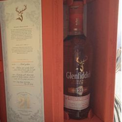 E & F Discount Liquors - Glenfiddech $200 bottle with broken seal and damaged box on the inside