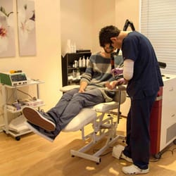 Lincoln Laser skincare - Nurse Practitioner Julian Kessler performing tattoo removal using the Asclepion Q-switched Ruby laser.