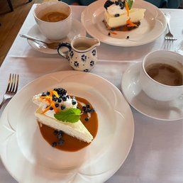 a plate of dessert and a cup of coffee a plate of dessert and a cup of coffee