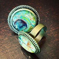 ElectricCoArt - Super cool resin rings are found in the lower level vendor market.