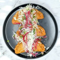 La Champa Latín Grill - Pastelitos - hand made pastry pockets filled with savory ground beef and potatoes.
