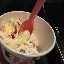 Two scoops with one bite taken out. Two scoops with one bite taken out.