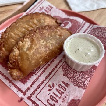 Colada Shop - Empanadas duo - abuela's plantain stew empanadas - Coffee & Tea Near Me - Arlington, Virginia Colada Shop - Empanadas duo - abuela's plantain stew empanadas - Coffee & Tea Near Me - Arlington, Virginia