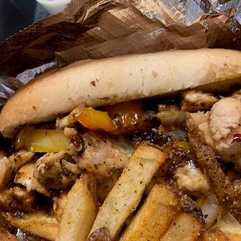 Shay's Wave - Jerk Chicken Philly Cheesesteak Close up - Food Trucks Near Me Shay's Wave - Jerk Chicken Philly Cheesesteak Close up - Food Trucks Near Me