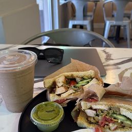 BYO with chicken, olives, tomatoes, micro greens with the best cilantro lime sauce on the side. Almond Date Coffee Slushie.