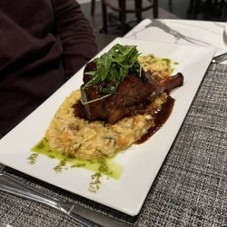 Piccolina Toscana - Braised Lamb Shank with fig and port wine infused demi-glace over butternut squash risotto