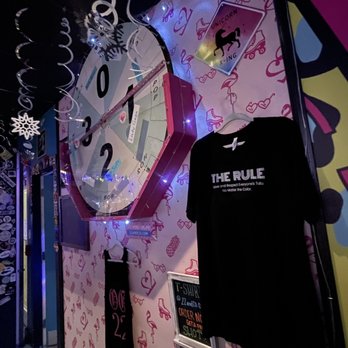 22&Co - the inside of a room with a clock and t - shirts - Bars Near Me - Key West, Florida 22&Co - the inside of a room with a clock and t - shirts - Bars Near Me - Key West, Florida