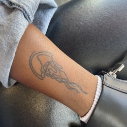 Aloha Monkey - Line art jellyfish tattoo on ankle