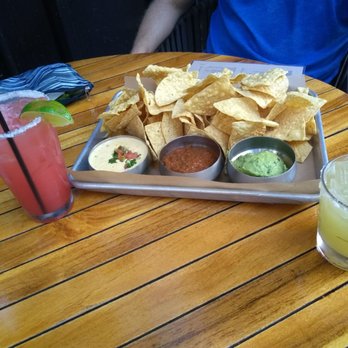 Corner Restaurant - Chips and salsa, queso, and guac and a corner Marg & Seasonal watermelon margarita. - Bars Near Me - Austin, Texas Corner Restaurant - Chips and salsa, queso, and guac and a corner Marg & Seasonal watermelon margarita. - Bars Near Me - Austin, Texas