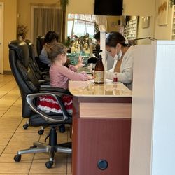 Gel Nail Spa - Emma getting her candy cane nails