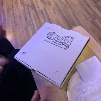 Totally Baked Pizza - a pizza box on a table - Pizza Near Me - Akron, Ohio Totally Baked Pizza - a pizza box on a table - Pizza Near Me - Akron, Ohio
