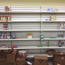 Dollar Tree - Bare, unstocked shelves.